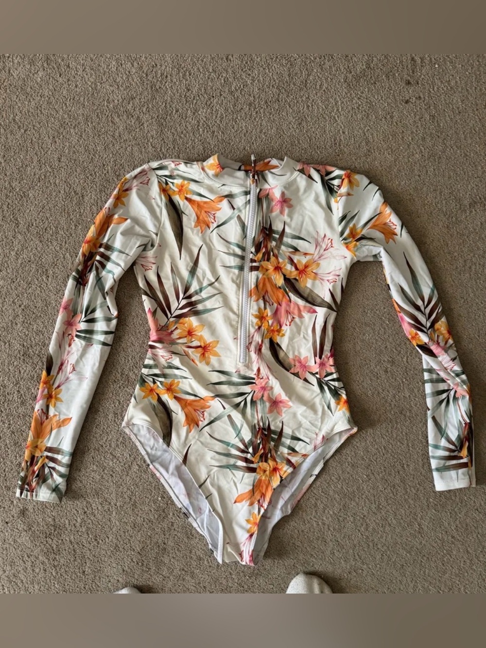 Floral Long-Sleeve women’s One-Piece Swimsuit in Cream with Yellow & Pink.